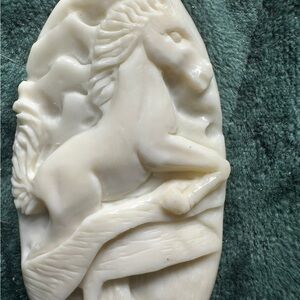 Carved bone equestrian pendant